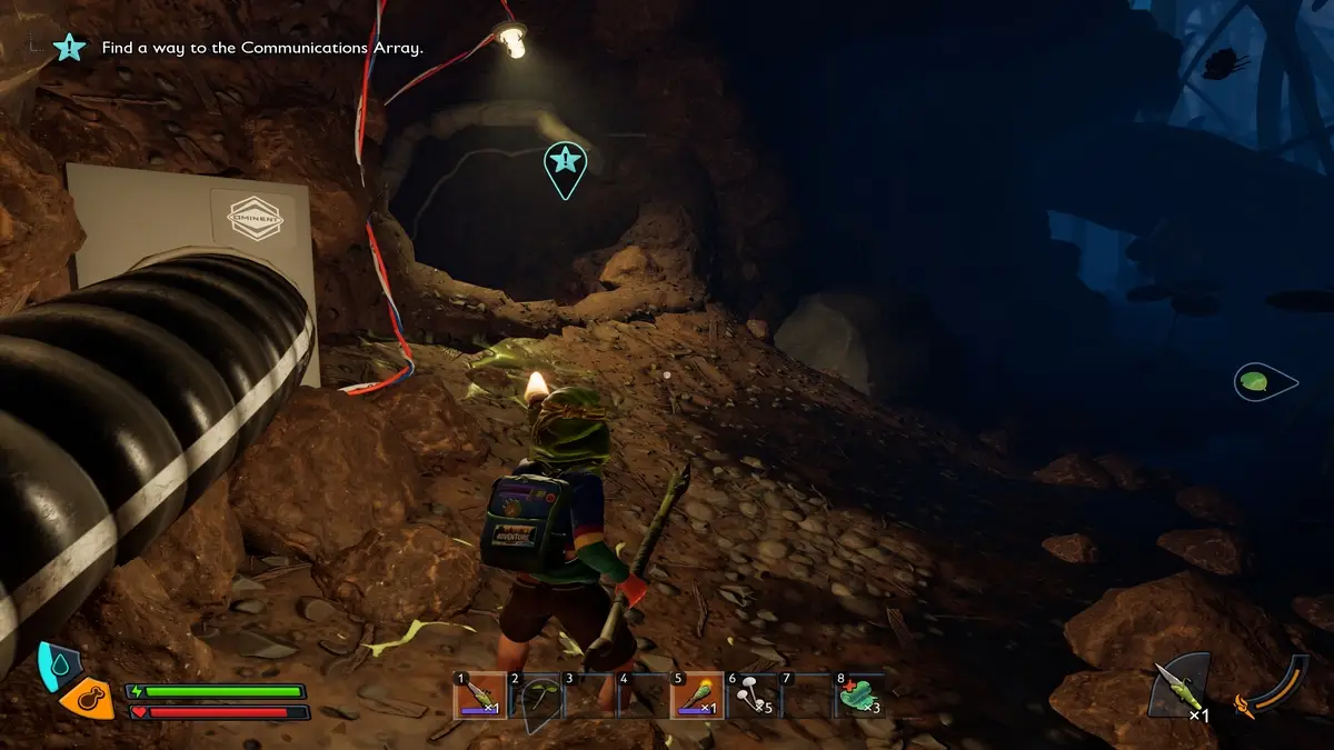Finding the entrance to a cave by following the black cable in Grounded 2