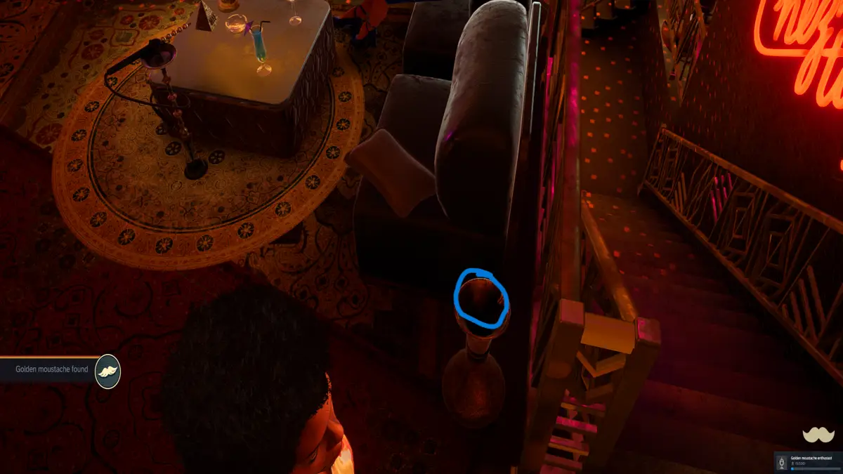 Mustache 5 inside of the golden spittoon on the VIP of the club by the stairs