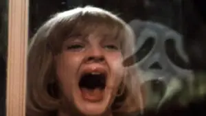 Screenshot of Drew Barry and Ghostface from Scream 1 used as the featured image for Scream movies ranked guide.
