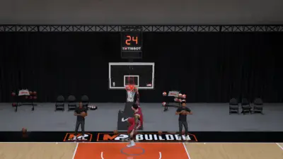 Screenshot of player Hanging onto the Rim in NBA 2K27 used as featured image for how to dunk guide.